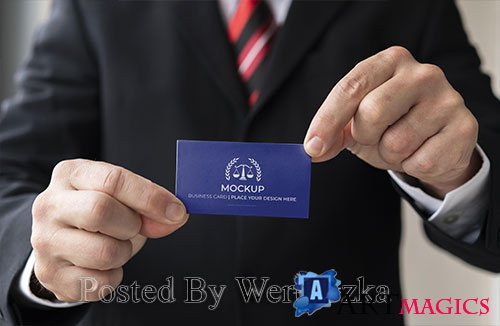 Close-up businessman holding business card mock-up with both hands