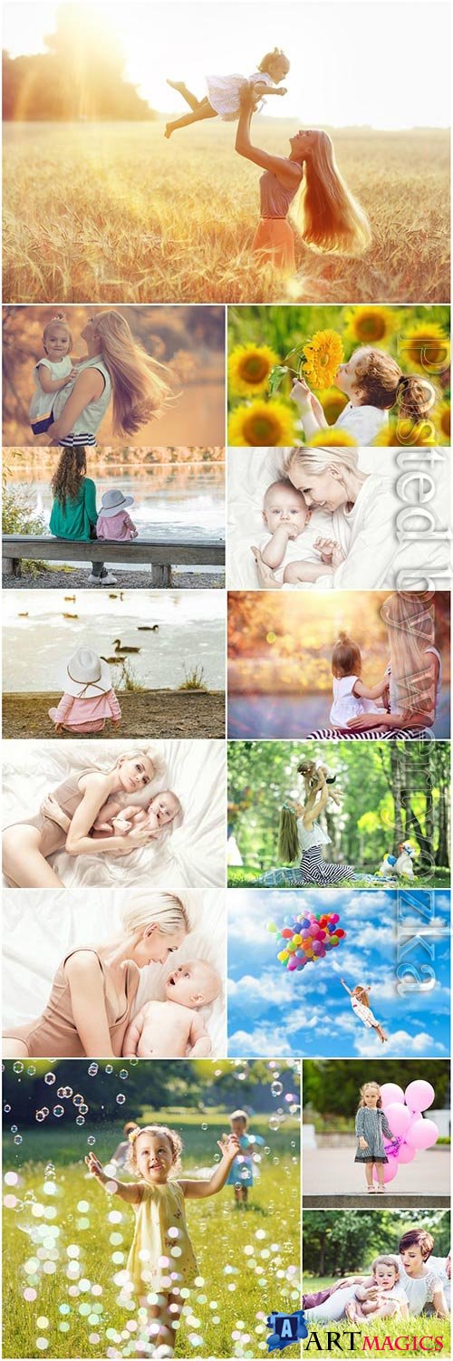 Children with mothers in nature stock photo